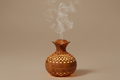 Sacred Mist Aromatherapy Diffuser on warm beige background